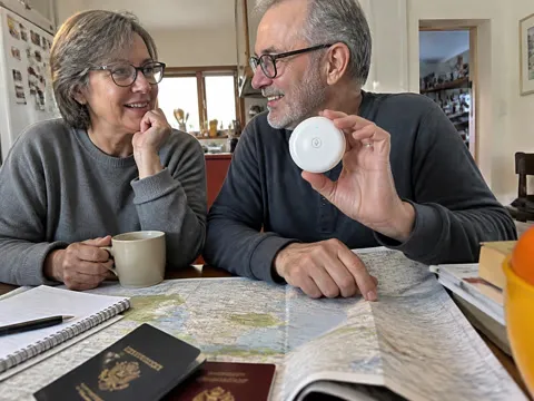 Couple trying the translator while planning a trip