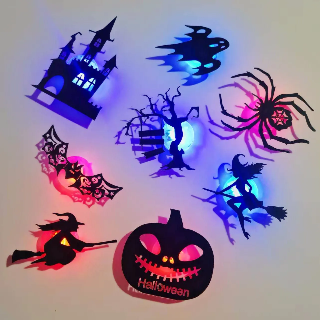 Halloween silhouettes glowing on a wall