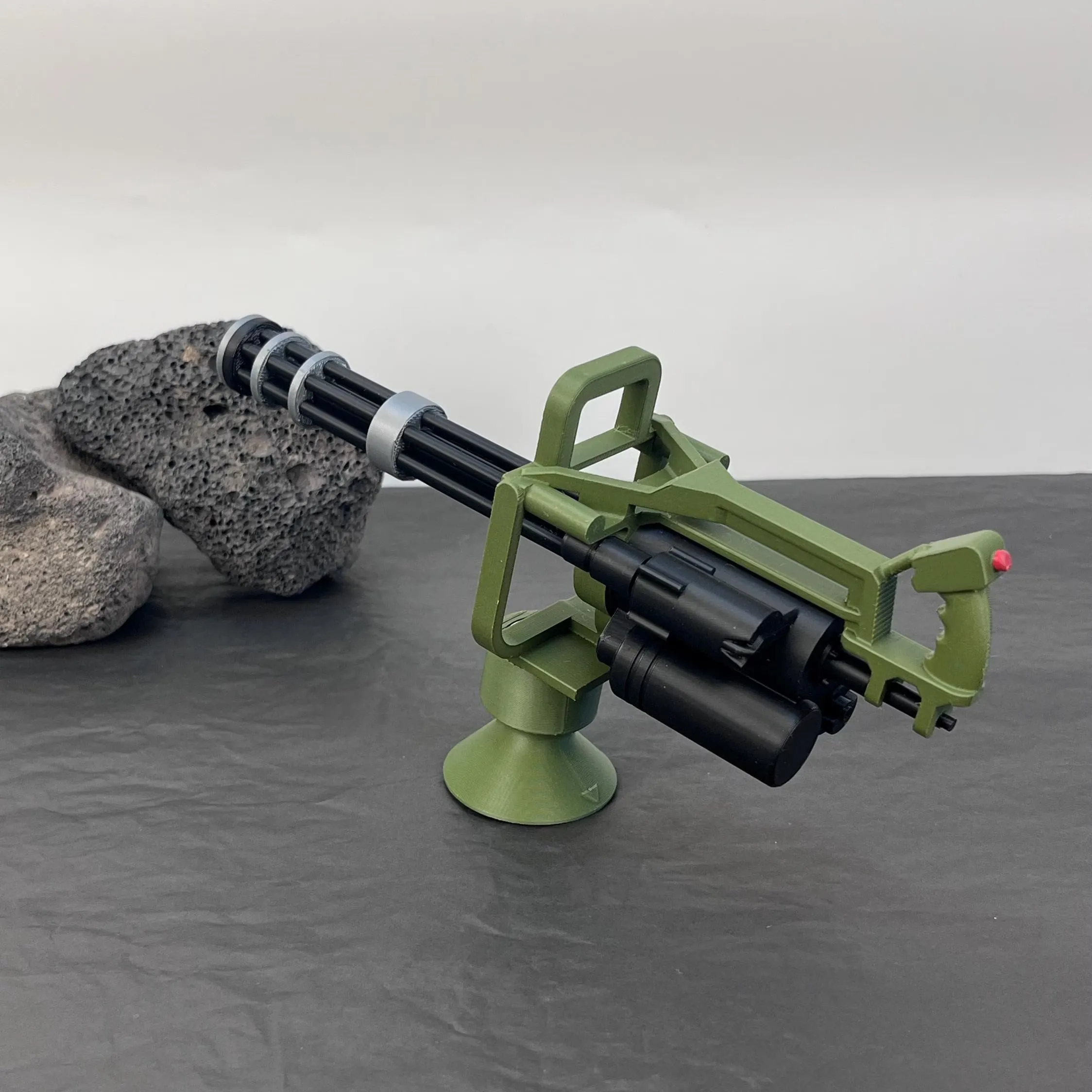 Close studio view of the army green Gatling-style ornament