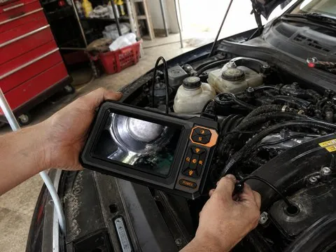 Inspection camera being used in a home garage