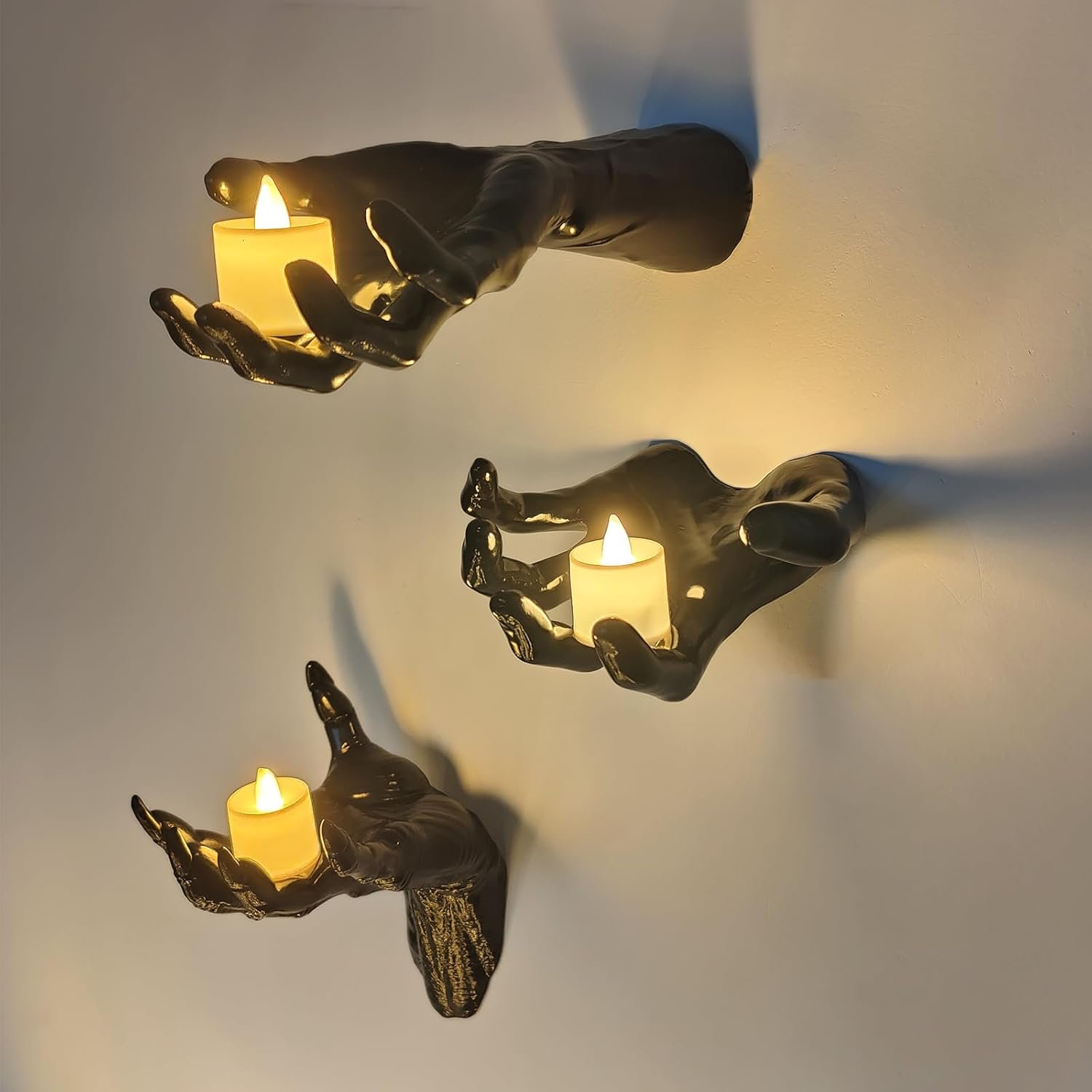 The complete three-piece glossy black creepy hand wall set