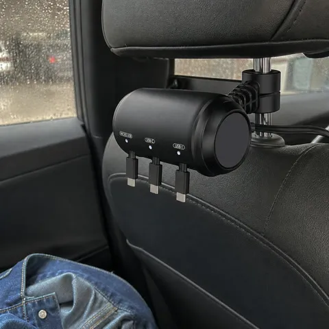 Retracted charger on a dark leather seat