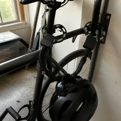 Helmet secured with a bicycle in a garage