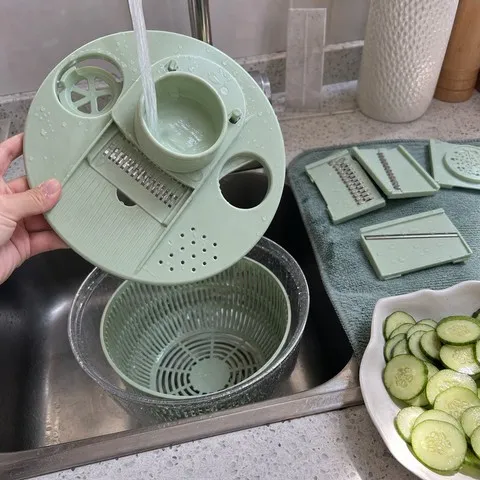 Fresh Green slicer top being rinsed at the sink