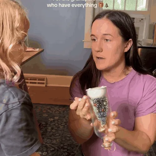 A family giving and using the recordable Christmas tree keepsake bottle