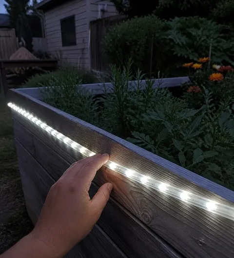 Installing strip light on a raised garden bed
