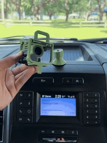 Close-up demonstration of the rotating barrel and pivoting dashboard ornament