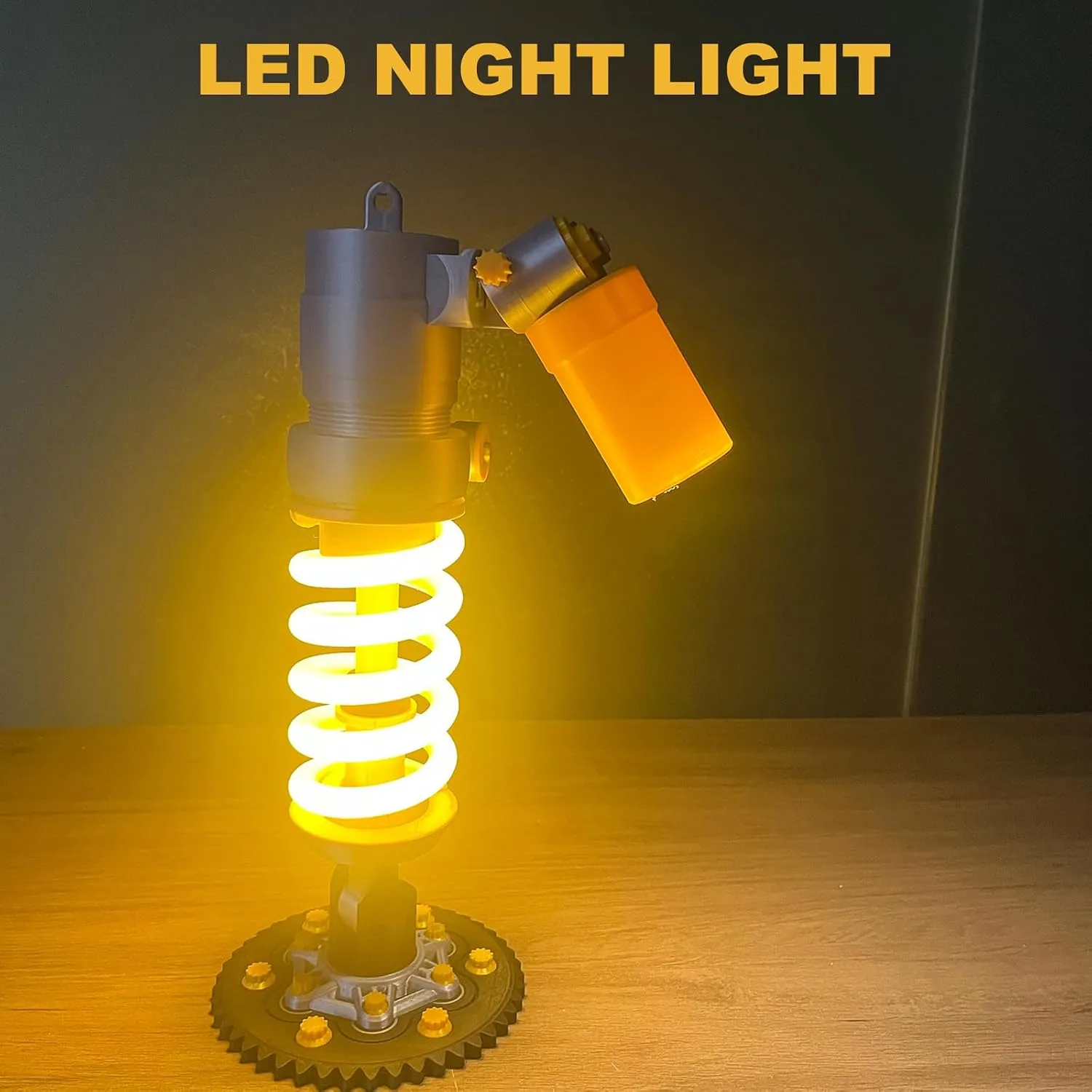 Battery-powered shock absorber lamp glowing on a tabletop