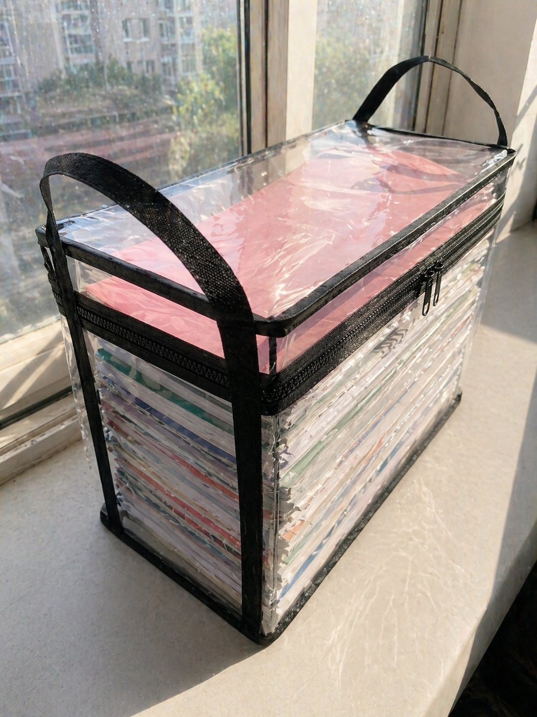Carrying heavy books in clear bin