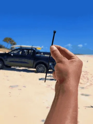 Quick-lock utility strap being tightened and released in outdoor settings