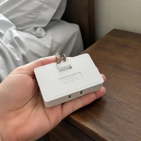 Adapter beside a bedroom nightstand