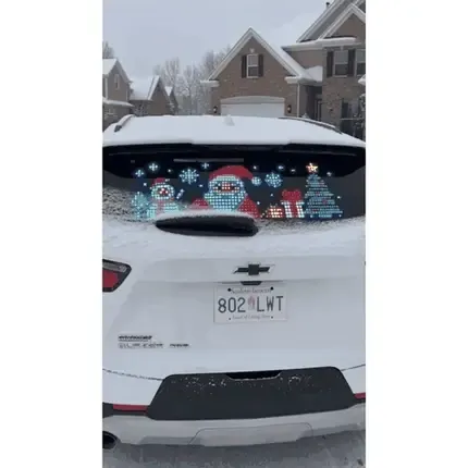 DrivePixel Christmas display on snowy SUV