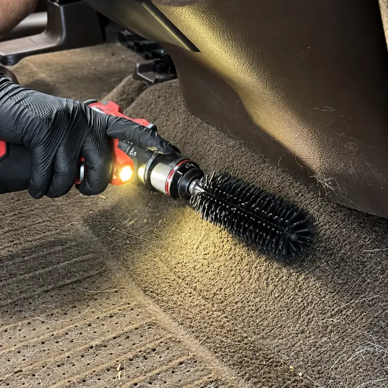 Silicone drill brush cleaning pet hair from car carpet