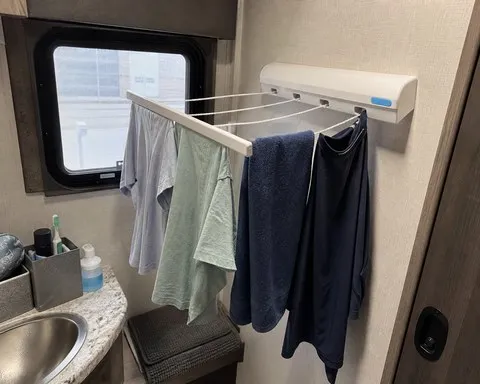 Four-line clothesline in a compact RV bathroom