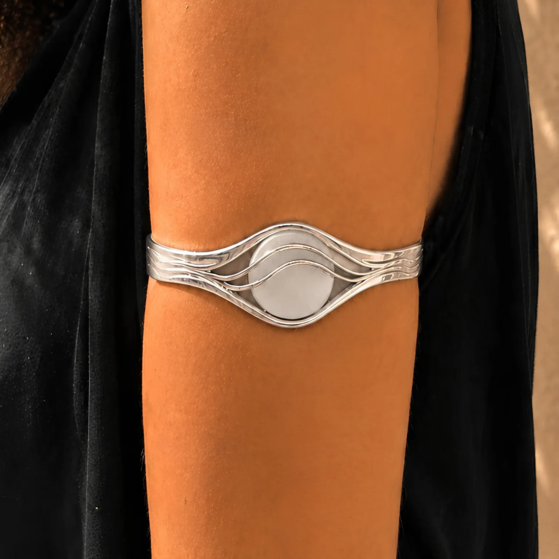 Close view of the silver wave-frame bracelet