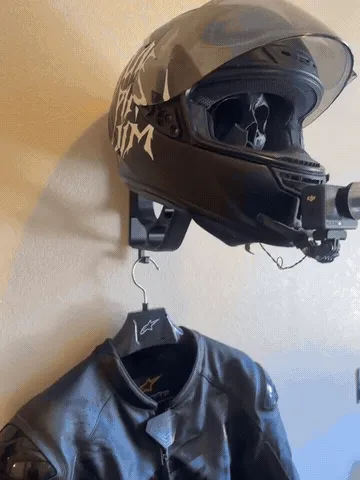Helmet and riding gear displayed on the skull wall mount