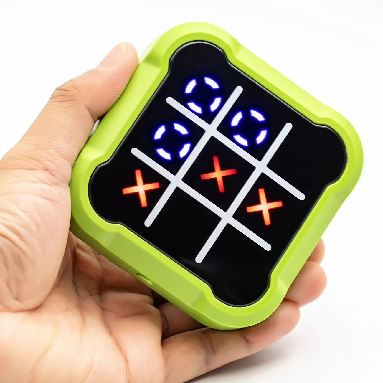 Compact electronic tic-tac-toe game held in one hand