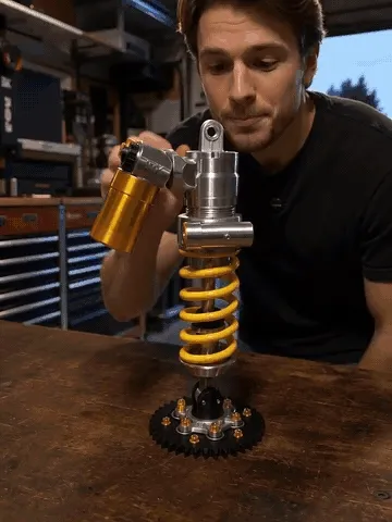 Shock absorber lamp shown on desks and beside model cars