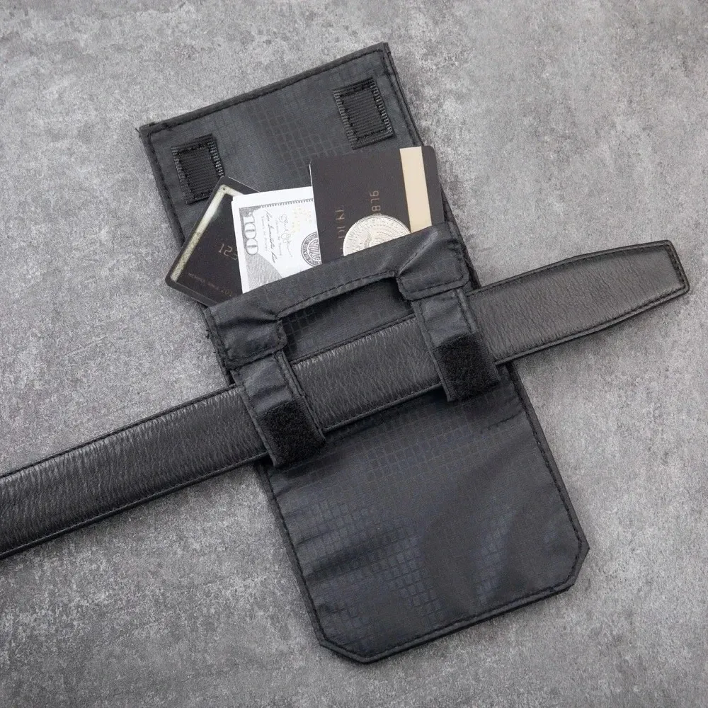 Traveler using a belt wallet in an airport lounge