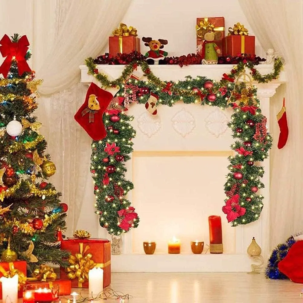 Pre-lit red and green Christmas garland decorating a fireplace
