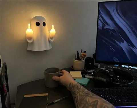 Ghost wall light mounted above a casual home office desk