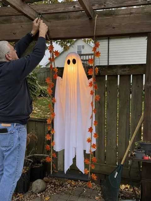 Installing the ghost swing under a backyard pergola
