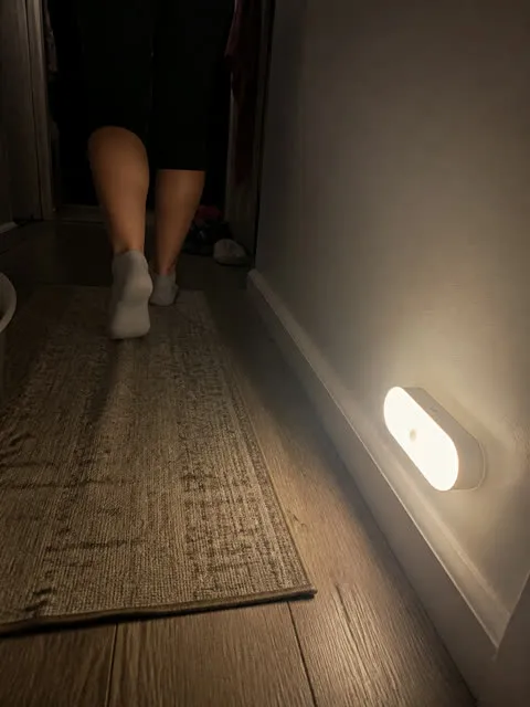 Night light illuminating a home hallway