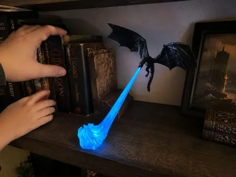 Family arranging books around a blue glow dragon decoration