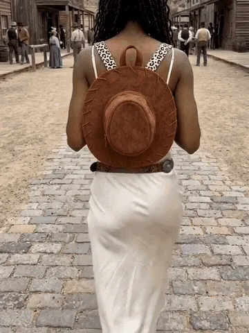 Western cowboy hat backpack shown in everyday use