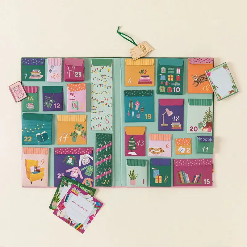 Book Lovers Advent Calendar with book-themed paper gifts and an open-book ornament