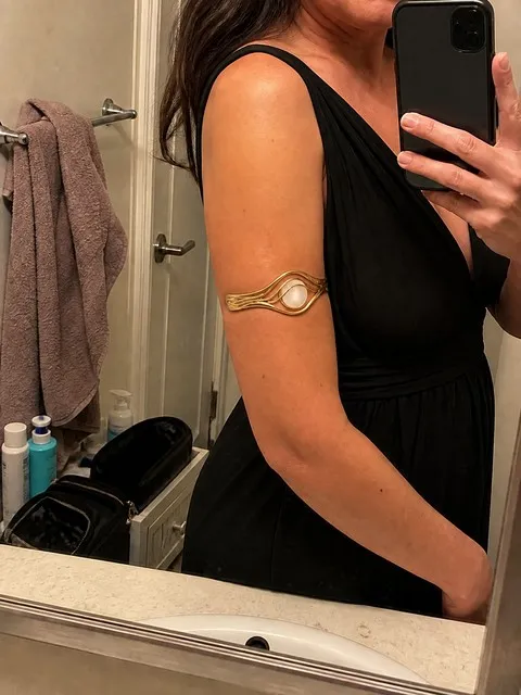Gold bracelet styled for an evening outfit