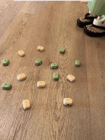 Two remote-control crocodile toys collecting magnetic pieces
