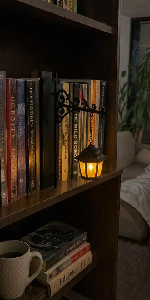 Lantern design glowing on an apartment bookshelf