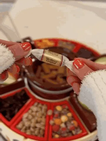 Caramel melting, apple dipping, and topping demonstration