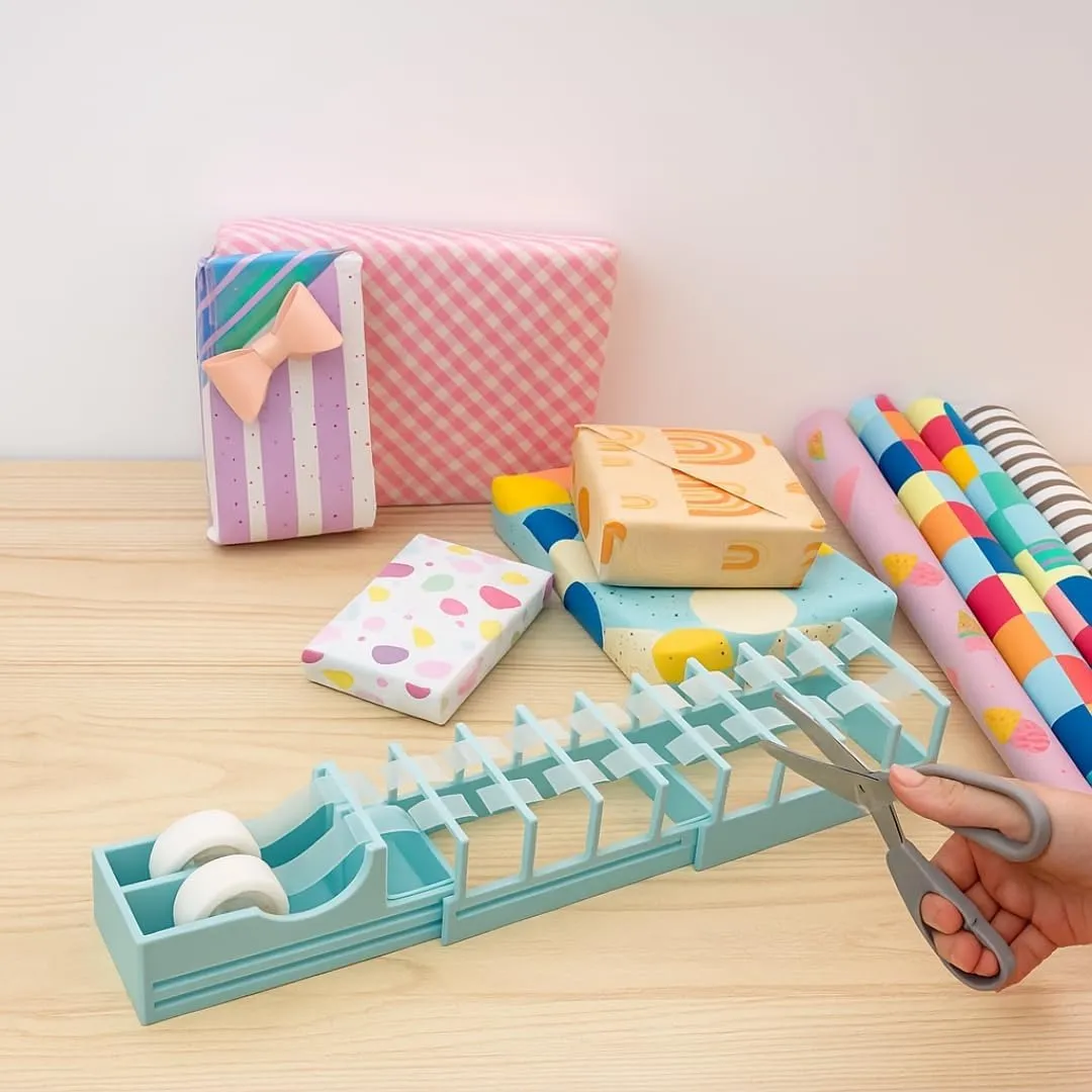 Expandable tape dispenser in a gift-wrapping workspace
