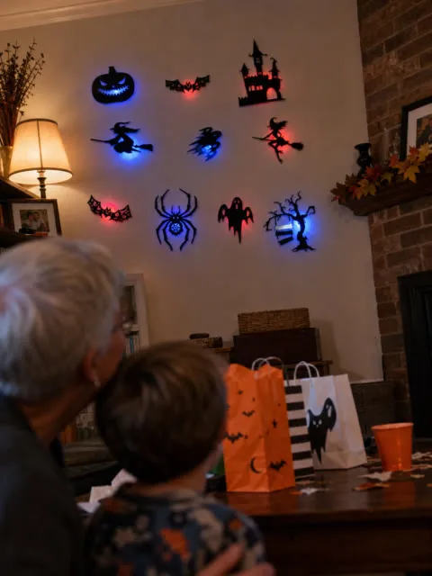 Family room with glowing Halloween wall decorations