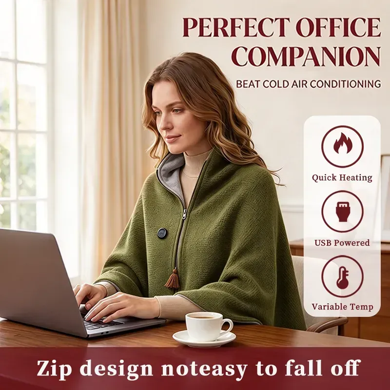 Green heated shawl worn at a laptop, showing the front zipper and control button
