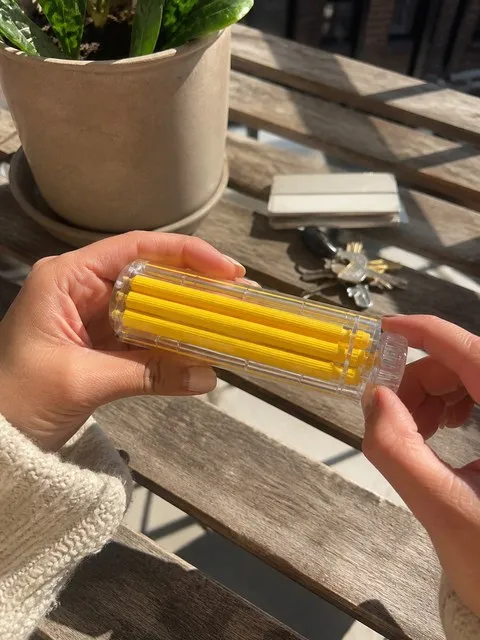 Manual roller being turned on a sunny balcony table