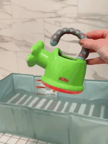 Foldable bath basin opening, holding the three play toys, draining, and folding flat