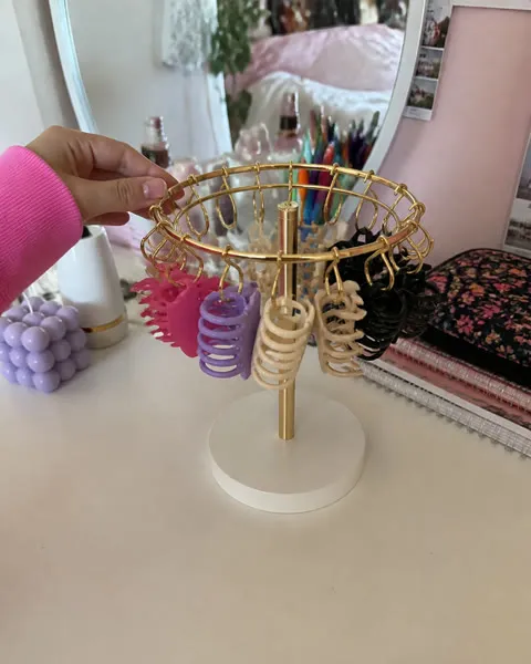 Colorful claw clips organized on a bedroom dresser