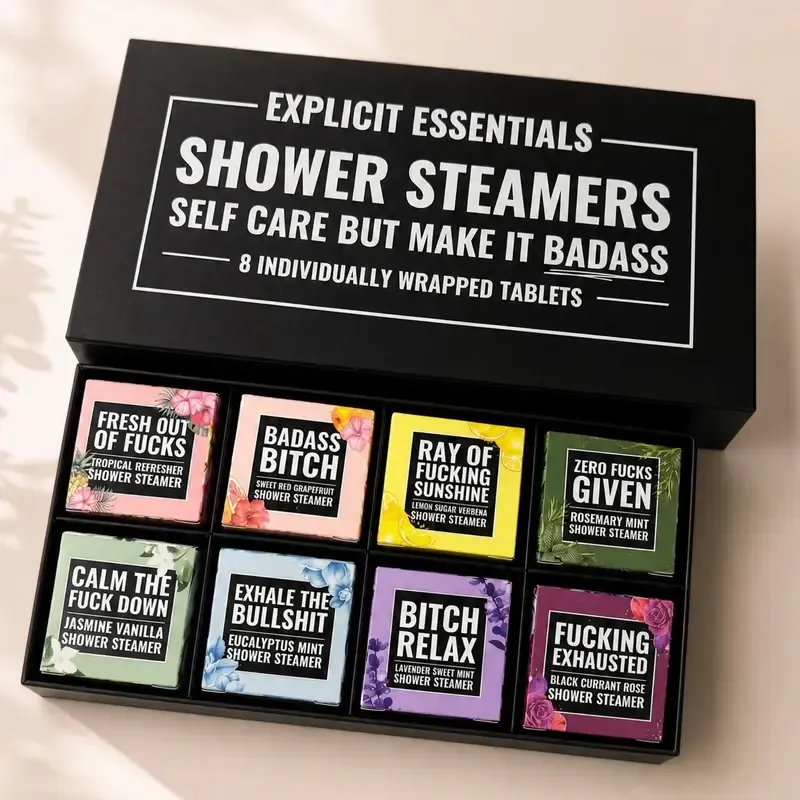 Open Explicit Essentials gift box with eight colorful shower steamers
