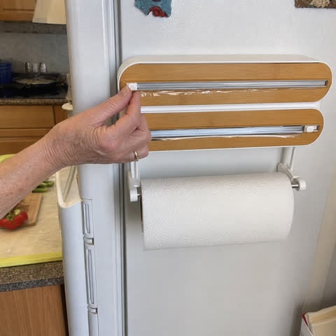 Kitchen wrap station mounted on a refrigerator during meal prep
