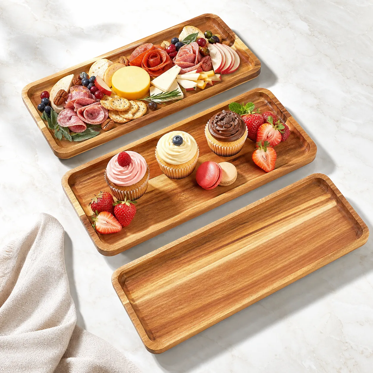 Three acacia wood serving trays