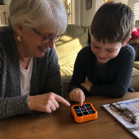 Grandmother and grandson playing together