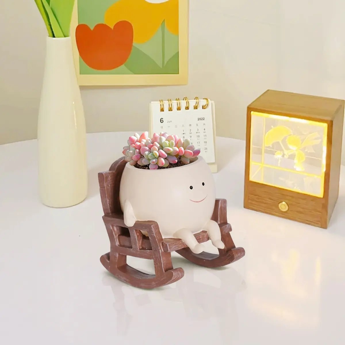 Planter placed on a cozy study desk next to a calendar Planter placed on a cozy study desk next to a calendar