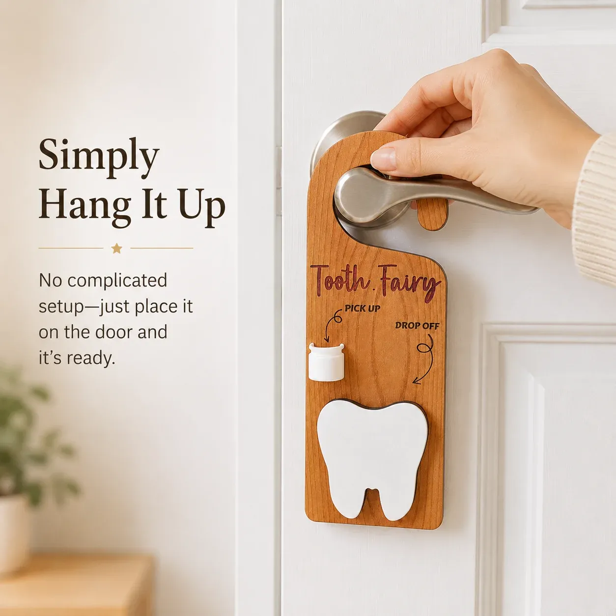 Adult hand placing the Tooth Fairy wooden door hanger onto a lever-style interior door handle