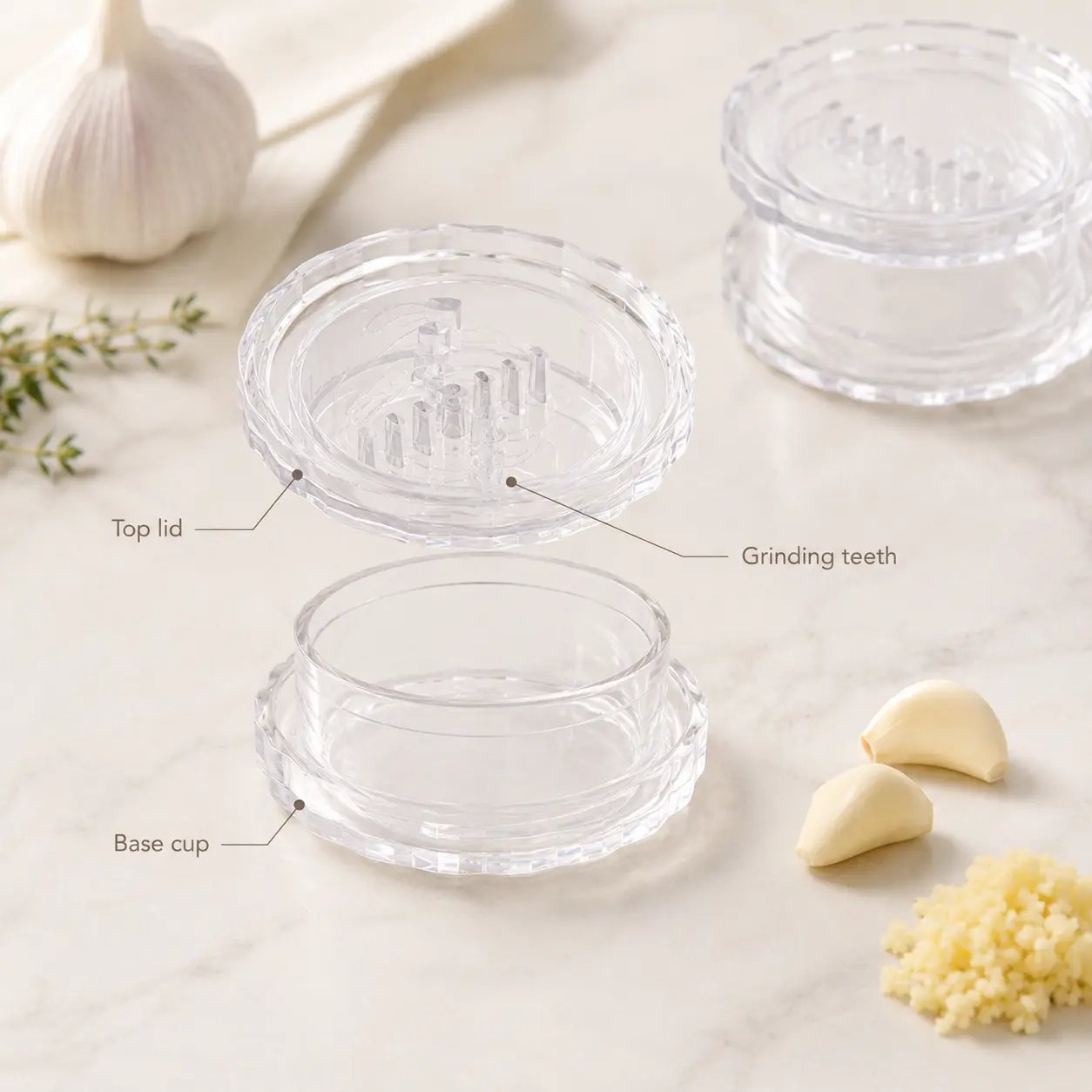 Garlic twister product breakdown showing top lid, grinding teeth, and base cup Garlic twister product breakdown showing top lid, grinding teeth, and base cup