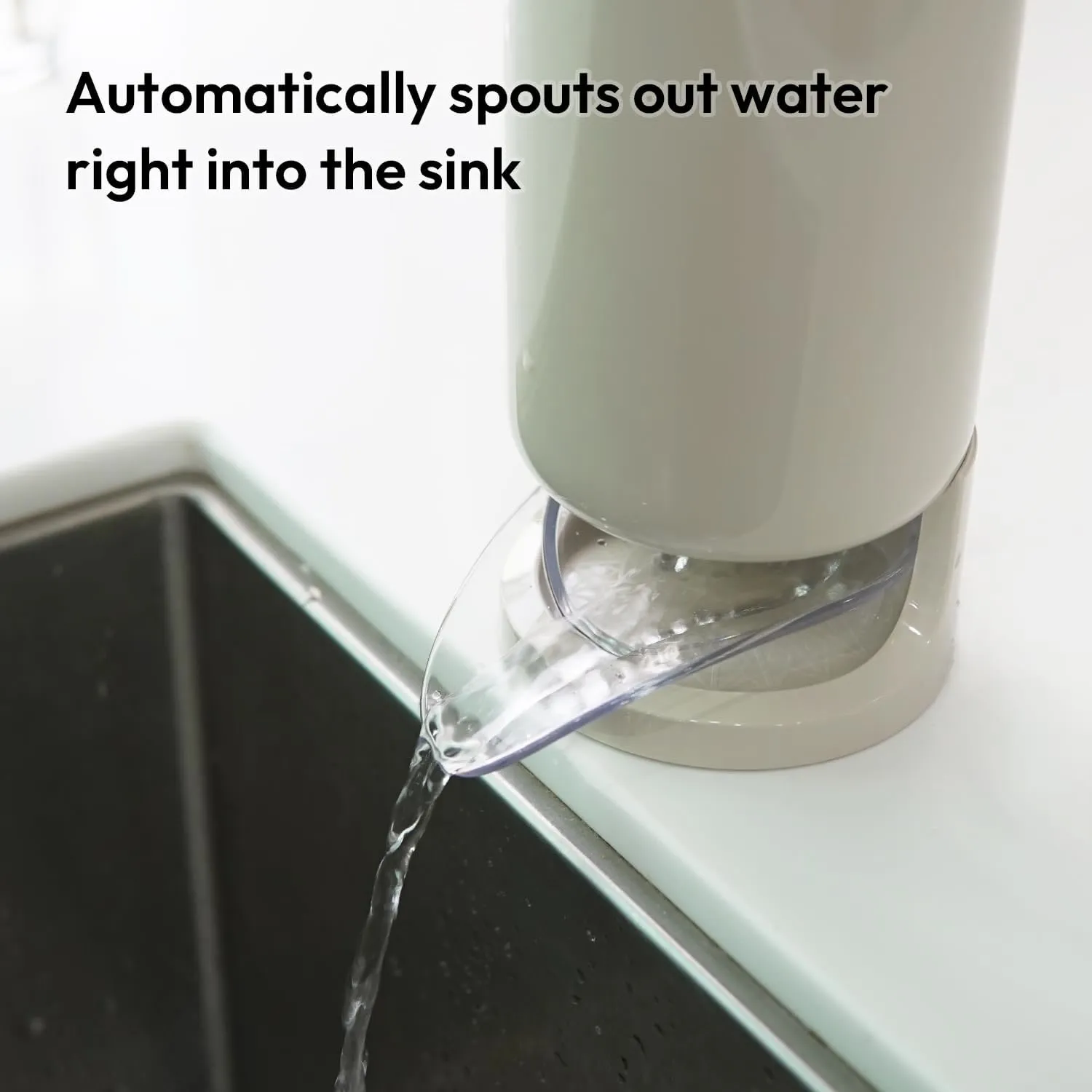 Clear angled drain spout directing water toward the sink